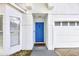 Close-up of the home's entrance featuring a striking blue door and a welcoming entrance at 2308 Donegan Pl, Orlando, FL 32826