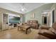 Spacious living room featuring plush sofas and a large TV, offering a cozy entertainment space at 2308 Donegan Pl, Orlando, FL 32826