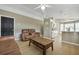 Open-concept living room with modern furnishings and seamless flow to the kitchen area at 2308 Donegan Pl, Orlando, FL 32826