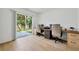 Sunlit home office featuring a double workstation with access to the backyard at 2308 Donegan Pl, Orlando, FL 32826