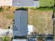 This aerial view showcases the backyard, roof, and nearby greenery of the property at 249 Spartan Dr, Maitland, FL 32751