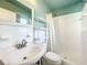 The bathroom features a shower with white tiling, vanity, and white shelving for storage at 249 Spartan Dr, Maitland, FL 32751