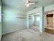 This bedroom features a mirrored closet, open shelving, and en suite bathroom at 249 Spartan Dr, Maitland, FL 32751