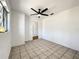 Bright room featuring a ceiling fan, tile floor, and a nearby window at 249 Spartan Dr, Maitland, FL 32751