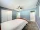 This bedroom features a ceiling fan, closet, and an ensuite bathroom, providing ample space for comfort and convenience at 249 Spartan Dr, Maitland, FL 32751