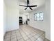 Bright dining room with modern ceiling fan and view of kitchen with stainless steel appliances at 249 Spartan Dr, Maitland, FL 32751