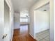 Hallway showcasing hardwood floors and access to the living room and tiled bathroom at 249 Spartan Dr, Maitland, FL 32751