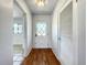 Hallway featuring hardwood floors, a closet, and a view of the adjacent room at 249 Spartan Dr, Maitland, FL 32751