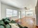 Living area featuring hardwood floors, large windows, and neutral paint colors at 249 Spartan Dr, Maitland, FL 32751