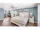 Spacious bedroom with an attached office featuring a desk, chair, and natural light creating a comfortable workspace at 25537 High Hampton Cir, Sorrento, FL 32776