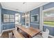Dining room with modern light fixture and seating for six at 25537 High Hampton Cir, Sorrento, FL 32776