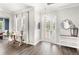 Elegant foyer with decorative mirror and stylish entry table at 25537 High Hampton Cir, Sorrento, FL 32776