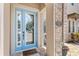 Elegant front door with decorative glass and stylish doormat at 25537 High Hampton Cir, Sorrento, FL 32776