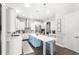 Beautiful kitchen featuring white cabinets, an island with bar seating, stainless appliances, and ample counter space at 25537 High Hampton Cir, Sorrento, FL 32776