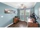 Bright office with a wood desk, task lighting, and neutral walls providing an ideal work environment at 25537 High Hampton Cir, Sorrento, FL 32776