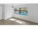 Light filled dining room with wood-look floors and a view of the pool at 2804 Clearfield Ave, Orlando, FL 32808