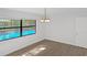 Dining room with a view of the enclosed pool area at 2804 Clearfield Ave, Orlando, FL 32808