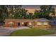 Beautiful single story home with a circular driveway and luscious green front lawn at 2804 Clearfield Ave, Orlando, FL 32808