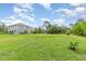Spacious backyard featuring lush lawn and exterior view of the home at 32125 Wekiva Pines Blvd, Sorrento, FL 32776