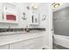 Elegant bathroom with double vanity, granite countertop, and combination tub and shower at 32125 Wekiva Pines Blvd, Sorrento, FL 32776