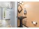 Charming half bathroom with pedestal sink and decorative mirror at 32125 Wekiva Pines Blvd, Sorrento, FL 32776