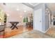 Open room featuring hardwood floors, foosball table, dining set and natural light at 32125 Wekiva Pines Blvd, Sorrento, FL 32776