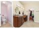 Bathroom featuring dual sinks, granite countertop, and tile flooring at 32125 Wekiva Pines Blvd, Sorrento, FL 32776