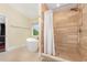 Well-lit bathroom featuring tile floors, free standing tub, and glass shower enclosure at 32125 Wekiva Pines Blvd, Sorrento, FL 32776