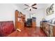 Spacious home office with rich wood floors, built-in desk, and ample storage at 32125 Wekiva Pines Blvd, Sorrento, FL 32776