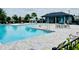 Community pool featuring lounge chairs, tables, and a splash fountain at 341 Switchgrass Loop, Minneola, FL 34715
