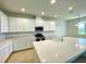 Elegant kitchen with a spacious island, stainless steel appliances, and ample counter space at 341 Switchgrass Loop, Minneola, FL 34715