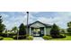 Community pool entrance featuring lush landscaping and clear signage at 341 Switchgrass Loop, Minneola, FL 34715