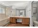 A bathroom with double sinks, a bathtub, and a large mirror at 3561 Ventura Club Cir, Orlando, FL 32822