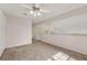 Open bedroom area with plush carpeting, neutral walls, and a decorative ceiling fan with lighting at 3561 Ventura Club Cir, Orlando, FL 32822