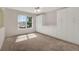 Bedroom with a large window, plush carpeting, neutral walls, and built in cabinetry for ample storage at 3561 Ventura Club Cir, Orlando, FL 32822