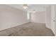 Spacious bedroom with neutral walls, carpet floors, ceiling fans with lighting, and closet space at 3561 Ventura Club Cir, Orlando, FL 32822