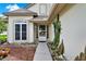 Inviting front entrance featuring a well-lit pathway and a decorative cactus at 3561 Ventura Club Cir, Orlando, FL 32822