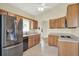 This kitchen features stainless steel appliances and hardwood cabinets at 3561 Ventura Club Cir, Orlando, FL 32822