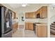This kitchen features stainless steel appliances and hardwood cabinets at 3561 Ventura Club Cir, Orlando, FL 32822