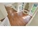 Open-concept living room with hardwood floors, a fireplace, and high ceilings at 3561 Ventura Club Cir, Orlando, FL 32822