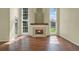 Spacious living room with tile flooring, fireplace, and expansive windows with natural light at 3561 Ventura Club Cir, Orlando, FL 32822