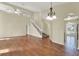 This living room features hardwood floors, high ceilings and a view of the staircase at 3561 Ventura Club Cir, Orlando, FL 32822