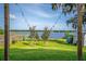 Spacious backyard with lush lawn and lake view, perfect for outdoor enjoyment at 36607 E Eldorado Lake Dr, Eustis, FL 32736