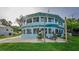Backyard with large patio, an outdoor seating area, a firepit, and mature landscaping at 36607 E Eldorado Lake Dr, Eustis, FL 32736