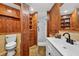 This bathroom has gorgeous wood accents, a shower, and modern vanity at 36607 E Eldorado Lake Dr, Eustis, FL 32736