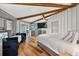 Spacious bedroom with wood floors, vaulted ceilings, a king bed, and lots of natural light at 36607 E Eldorado Lake Dr, Eustis, FL 32736