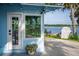 Side view of the home with a water view, landscaping, and a quaint shed at 36607 E Eldorado Lake Dr, Eustis, FL 32736