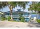 Stunning two-story home with a white railing balcony and a lake view at 36607 E Eldorado Lake Dr, Eustis, FL 32736