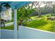 Exterior lights and flowering plants surrounding a beautiful blue house at 36607 E Eldorado Lake Dr, Eustis, FL 32736