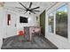 An entertainment room featuring a foosball table, tile floors, and a wall-mounted television at 36607 E Eldorado Lake Dr, Eustis, FL 32736
